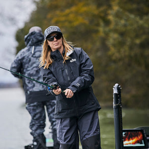 Woman fishing in Gill jacket